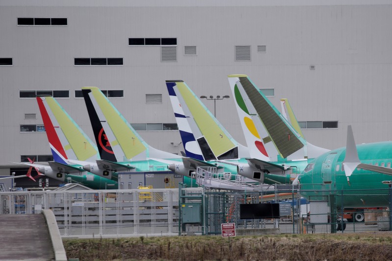 FILE PHOTO: The tails of Boeing 737 MAX aircraft are seen at a Boeing production facility in Renton, Washington