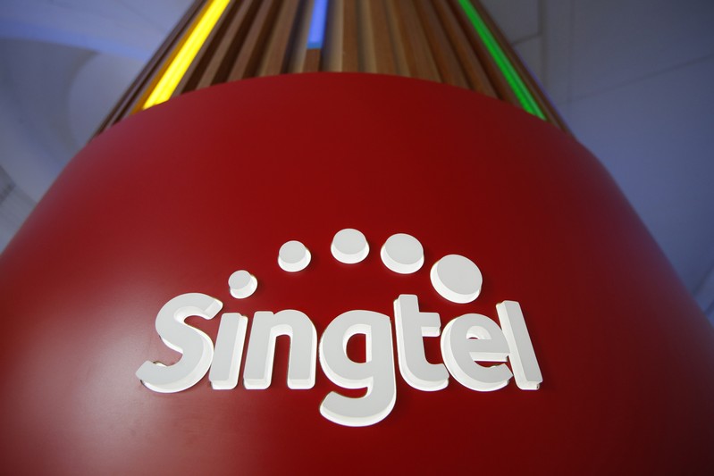 FILE PHOTO: A Singtel logo is pictured at their head office in Singapore