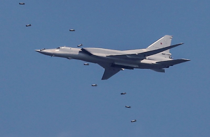 A Tupolev Tu-22M3 strategic bomber drops bombs during the Aviadarts competition at the Dubrovichi range outside Ryazan