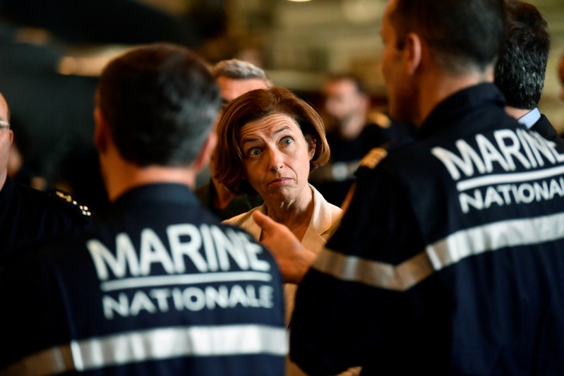 FILE PHOTO - French Defence Minister Florence Parly stands with marine officers as she visits the aircraft carrier