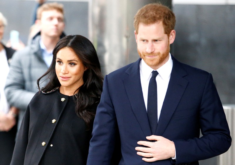 Britain's Prince Harry and Meghan, Duchess of Sussex visit the New Zealand House to sign the book of condolence on behalf of the Royal Family in London