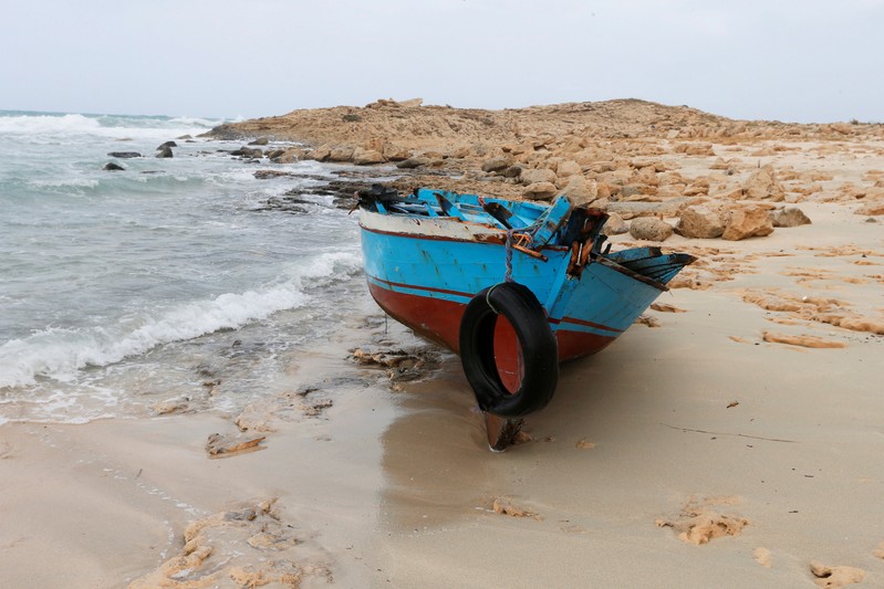 A boat used by migrants is seen near the western town of Sabratha