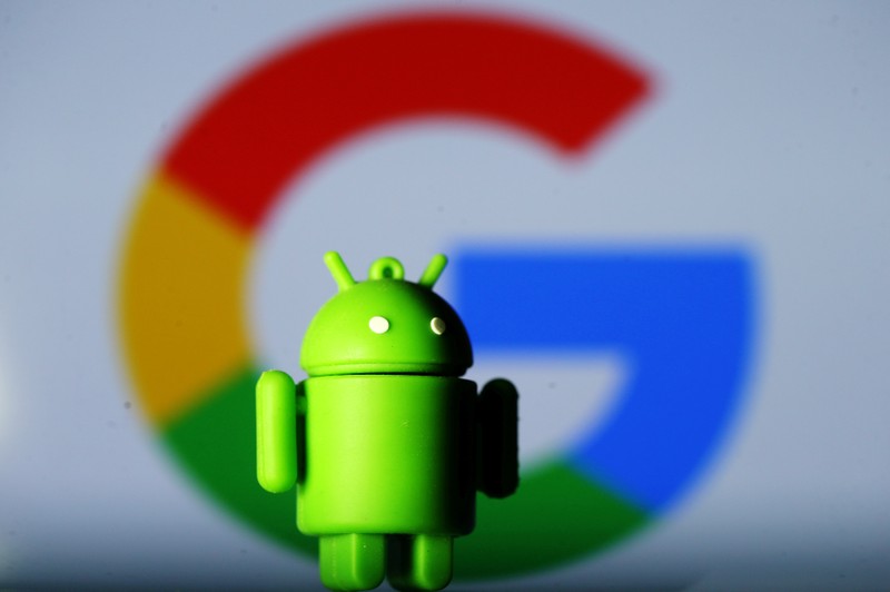 FILE PHOTO: A 3D printed Android mascot Bugdroid is seen in front of a Google logo in this illustration