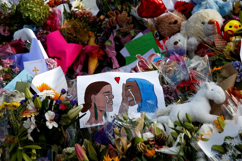 Flowers and cards are seen at the memorial site for the victims of Friday's shooting, outside Al Noor mosque in Christchurch