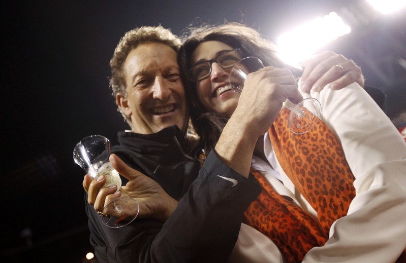 FILE PHOTO: Giants President Baer and wife Pam celebrate after Giants defeated Padres in MLB game in San Francisco