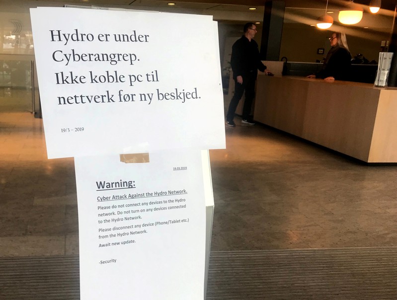 A sign warning employees not to connect devices to the network in the wake of a cyber attack is seen at the headquarters of aluminum producer Norsk Hydro in Oslo