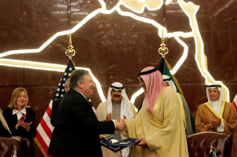 U.S. Secretary of State Mike Pompeo shakes hands with Kuwait's Foreign Minister Sheikh Sabah Al-Khalid Al-Sabah in Kuwait