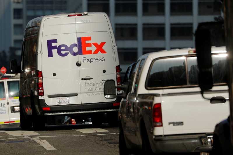 A Federal Express delivery truck is shown in downtown Los Angeles