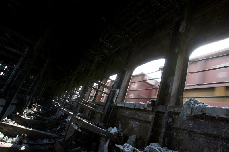 FILE PHOTO: A view of a burnt carriage of Samjhauta Express train in Deewana near Panipat town