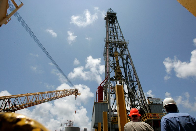 FILE PHOTO: Men in construction hats are seen aboard Chevron's Petronius oil platform in the Gulf of Mexico