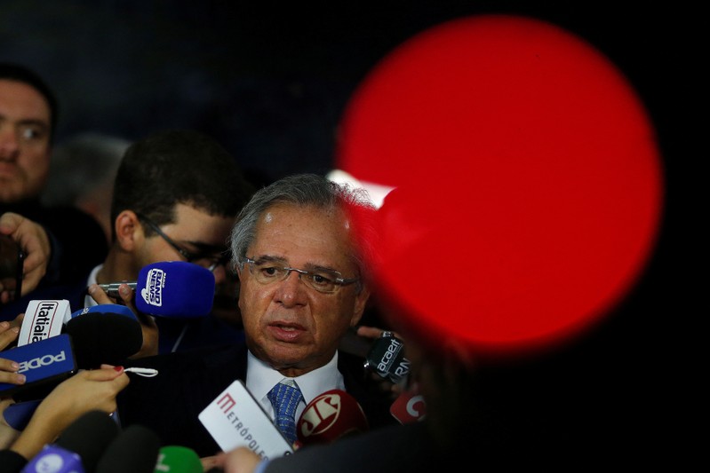Brazil's Economy Minister Paulo Guedes speaks with journalists after meeting with Brazil's President Jair Bolsonaro at the National Congress, in Brasilia