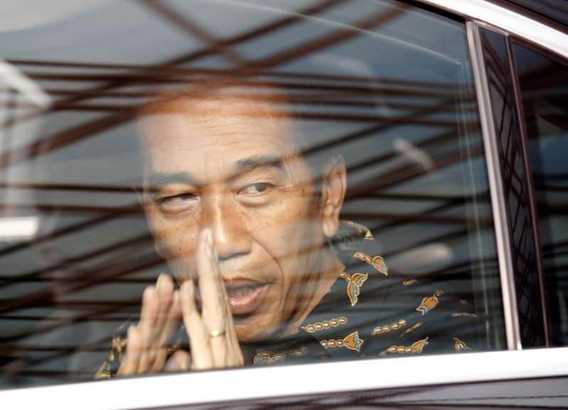 Indonesian President Joko Widodo leaves after visiting former first lady Ani Yudhoyono at a hospital in Singapore