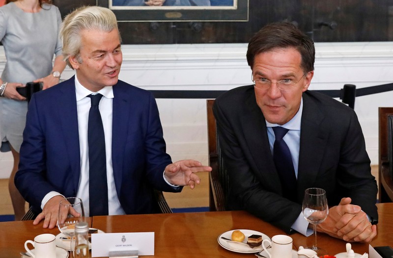 Dutch Prime Minister Rutte of the VVD Liberal party and Dutch far-right politician Wilders of the PVV Party take part in a meeting at the Dutch Parliament after the general election in The Hague