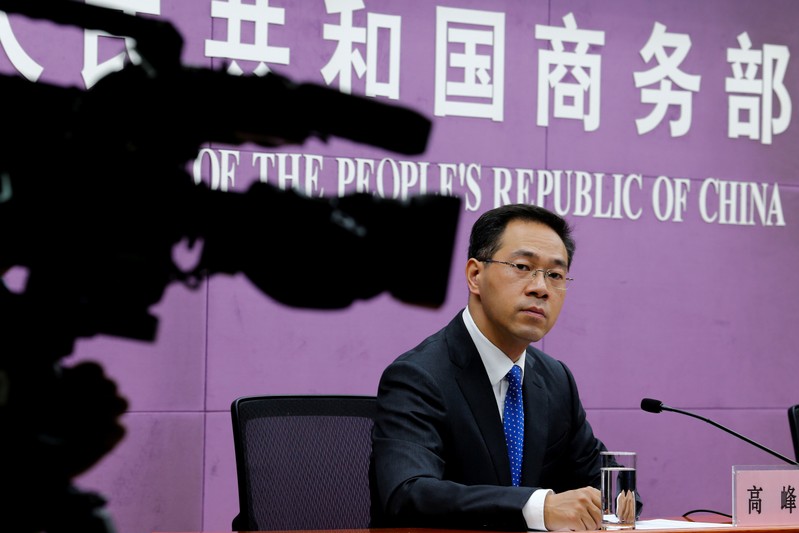 FILE PHOTO: China's Ministry of Commerce spokesperson Gao Feng attends a news conference at the commerce ministry in Beijing