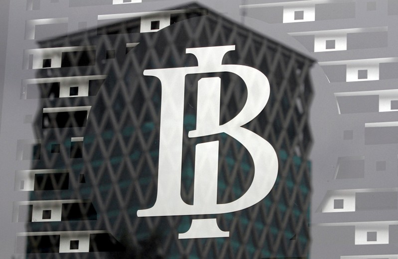 FILE PHOTO: The logo of Indonesia's central bank, Bank Indonesia, is seen on a window in the bank's lobby in Jakarta