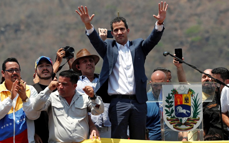 FILE PHOTO: Venezuelan opposition leader Juan Guaido, who many nations have recognised as the country's rightful interim ruler, takes part in a rally against President Nicolas Maduro's government in Valencia, Venezuela
