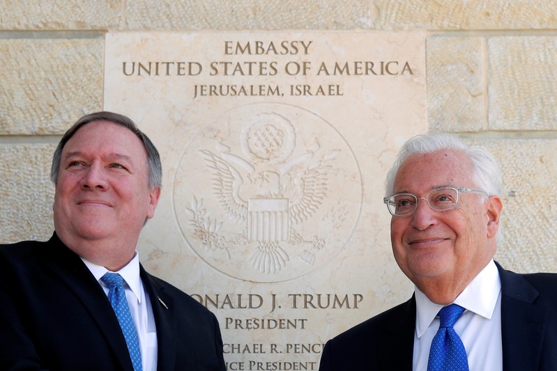 U.S. Secretary of State Mike Pompeo and U.S. Ambassador to Israel David Friedman stand next to the dedication plaque at the U.S. embassy in Jerusalem