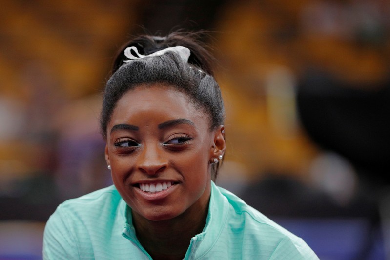 Simone Biles smiles during warm-ups at the U.S. Gymnastics Championships in Boston