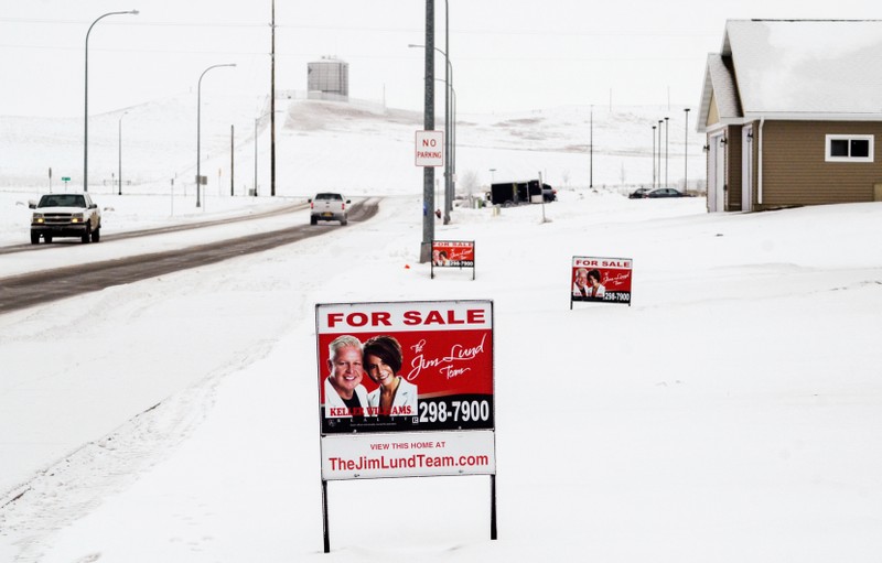 A sign advertises homes for sale in a new housing development in Dickinson