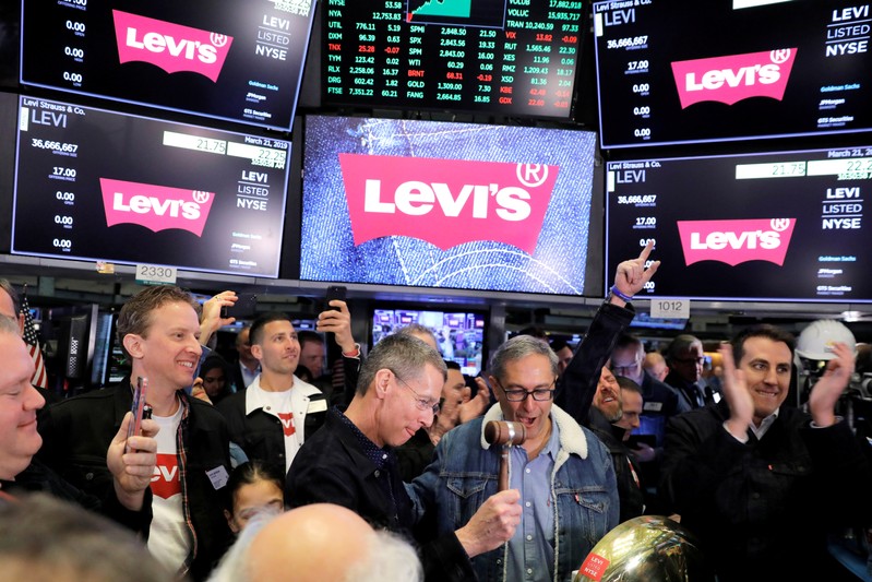 FILE PHOTO: Levi Strauss & Co. CEO Chip Bergh and CFO Harmit Singh ring bell during IPO on floor of New York Stock Exchange (NYSE) in New York