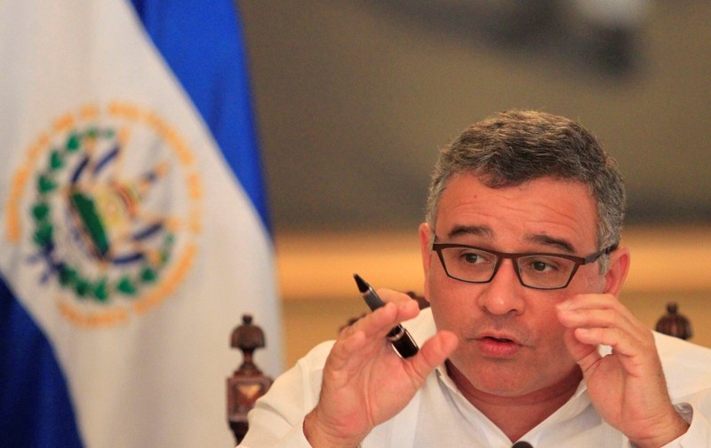 FILE PHOTO: El Salvadoran President Mauricio Funes speaks with journalists in a hall of the presidential palace in San Salvador