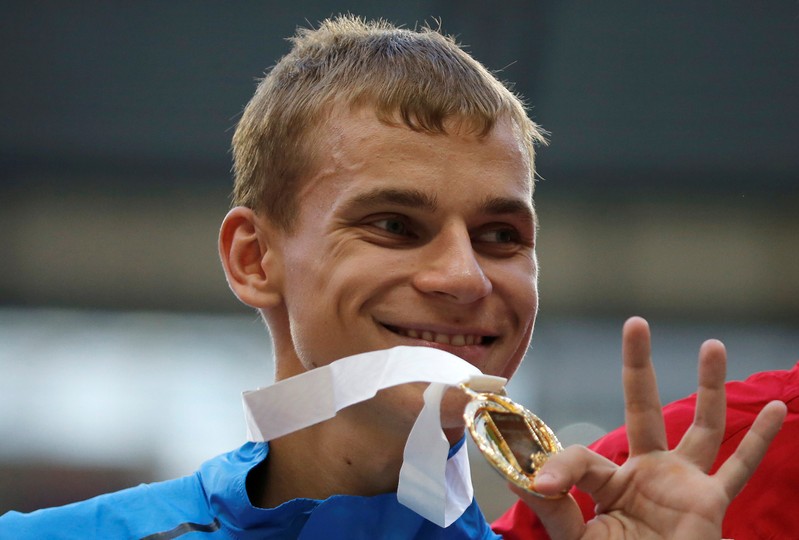 Gold medallist Ivanov of Russia poses during the award ceremony for the men's 20 km race walk final during the IAAF World Athletics Championships at the Luzhniki stadium in Moscow
