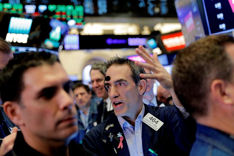 Traders work on the floor of New York Stock Exchange (NYSE) in New York
