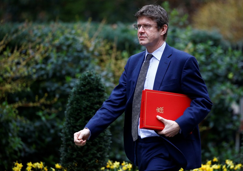 Britain's Secretary of State for Business Greg Clark walks outside Downing Street in London