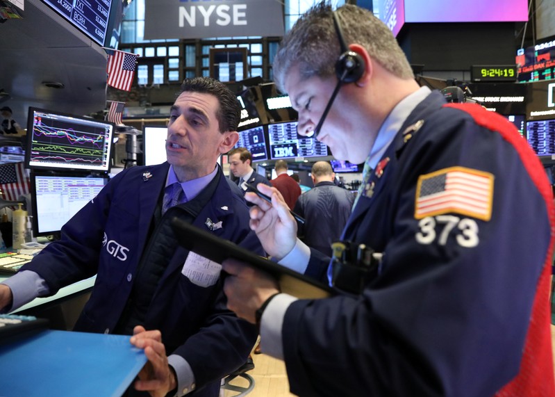Traders work on the floor at the NYSE in New York