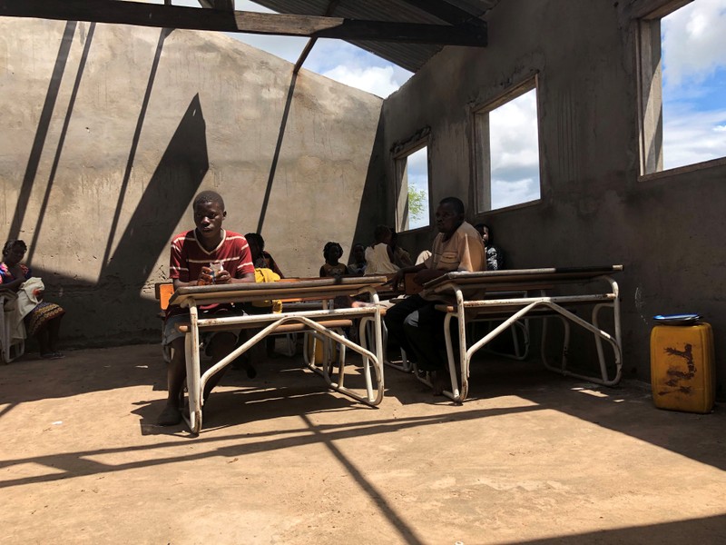 People take shelter after Cyclone Idai in a secondary school in Guara Guara outside Beira