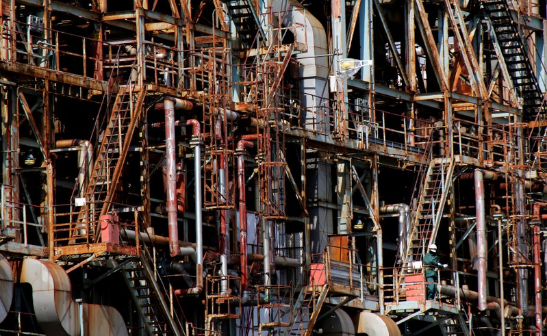 FILE PHOTO: Worker is seen at a factory at the Keihin industrial zone in Kawasaki