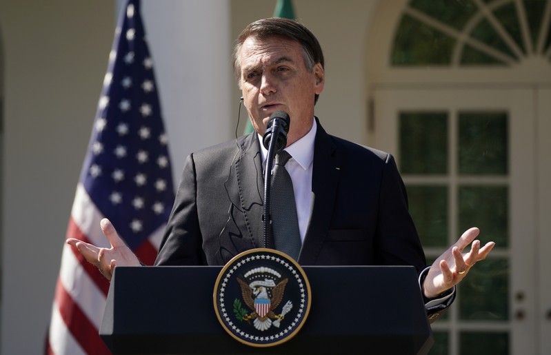 U.S. President Donald Trump and Brazil's President Jair Bolsonaro hold a joint news conference at the White House in Washington