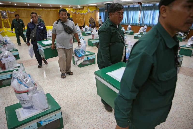 Bangkok district officers prepare ballot boxes and other documents ahead of the general election at a local district office in Bangkok