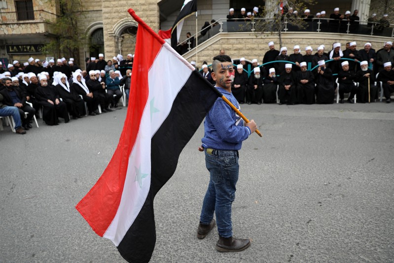 Druze people take part in a rally over U.S. President Donald Trump's support for Israeli sovereignty over the Golan Heights, in Majdal Shams near the ceasefire line between Israel and Syria in the Israeli occupied Golan Heights