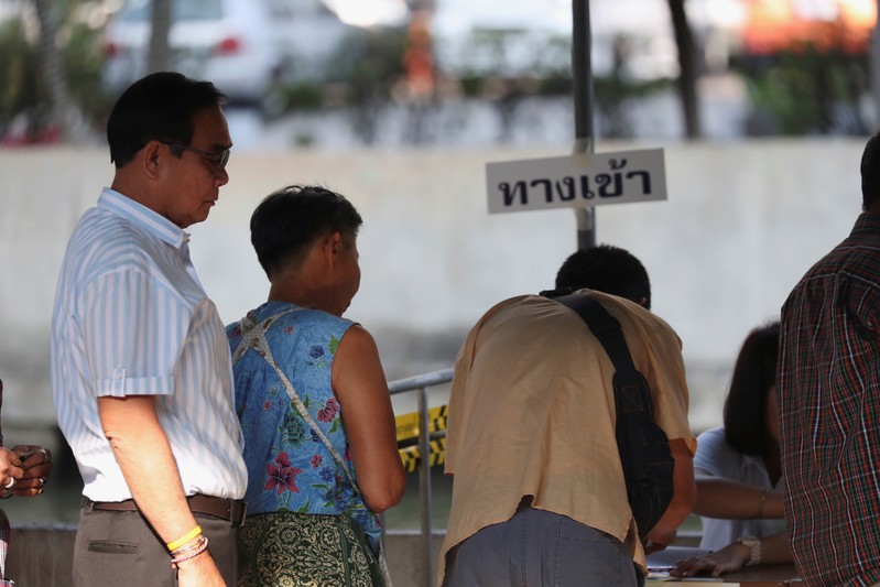 Thailand's Prime Minister Prayuth Chan-ocha prepares to vote in the general election at a polling station in Bangkok