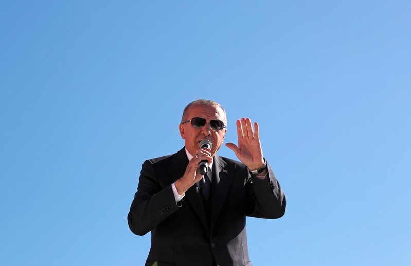 Turkish President Tayyip Erdogan addresses supporters during a rally for the upcoming local elections, in Istanbul