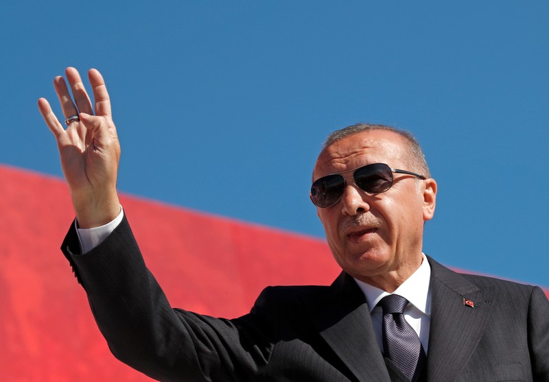 Turkish President Tayyip Erdogan addresses supporters during a rally for the upcoming local elections, in Istanbul