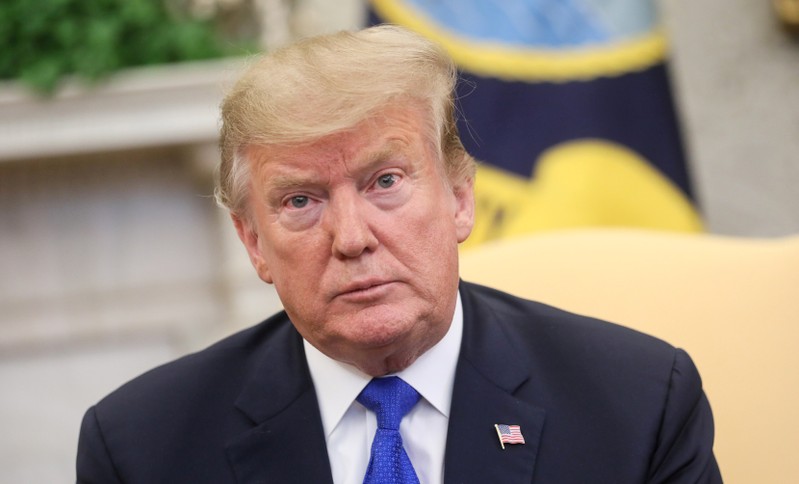 FILE PHOTO: U.S. President Donald Trump meets with former hostage Danny Burch and his family in the Oval Office at the White House