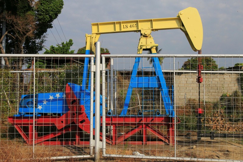 FILE PHOTO: An oil pumpjack painted with the colors of the Venezuelan flag is seen in Lagunillas
