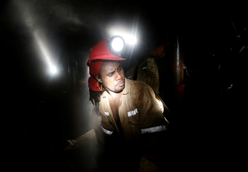 FILE PHOTO: Miner works deep underground at Sibanye Gold's Masimthembe shaft in Westonaria