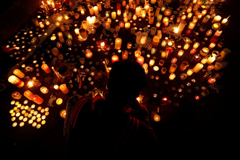 People visit a memorial site for victims of Friday's shooting, in front of the Masjid Al Noor mosque in Christchurch