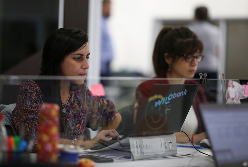 Employees work at the Wilobank offices, in Buenos Aires