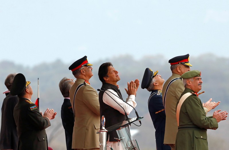 Pakistani PM Imran Khan observes the fly-past during the Pakistan Day military parade in Islamabad