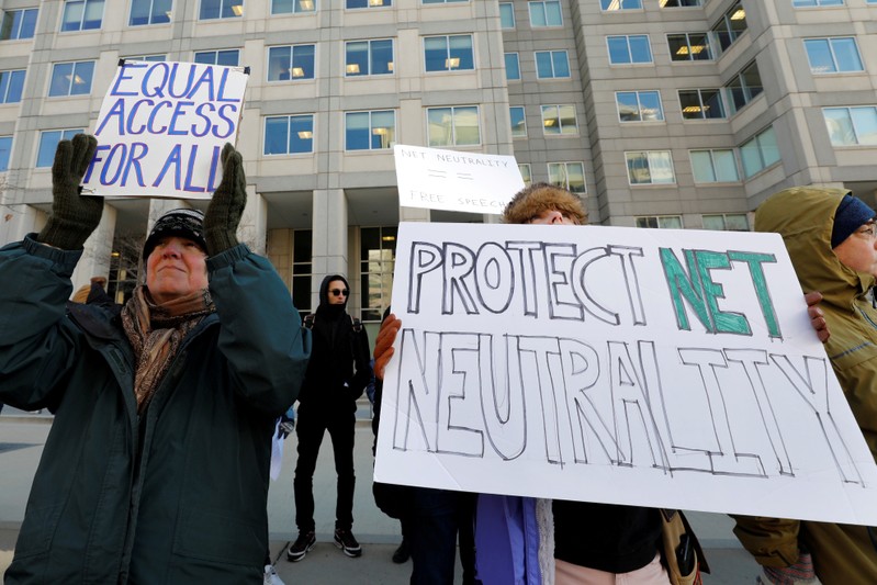 FILE PHOTO: Net neutrality advocates rally in front of the Federal Communications Commission in Washington