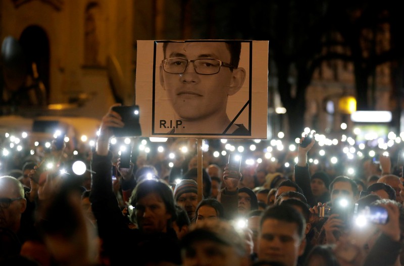 FILE PHOTO: Demonstrators take part in a protest rally marking the first anniversary of the murder of investigative reporter Jan Kuciak and his fiancee Martina Kusnirova in Bratislava