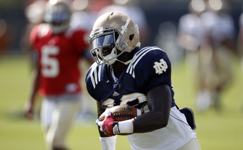 Fighting Irish running back Wood runs a play during a practice session in Davie, Florida