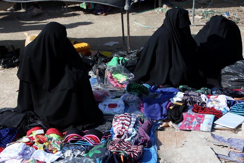 Women sell underwear at al-Hol displacement camp in Hasaka governorate