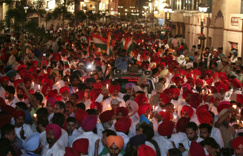 People partricipate in a candle light vigil to pay homage outside Jallianwala Bagh memorial to mark 100th anniversary of Jallianwala Bagh massacre in Amritsar