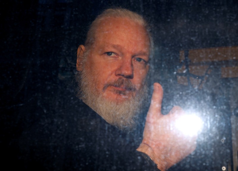 FILE PHOTO: WikiLeaks founder Julian Assange is seen as he leaves a police station in London