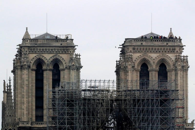 Firefighters work at Notre-Dame Cathedral in Paris